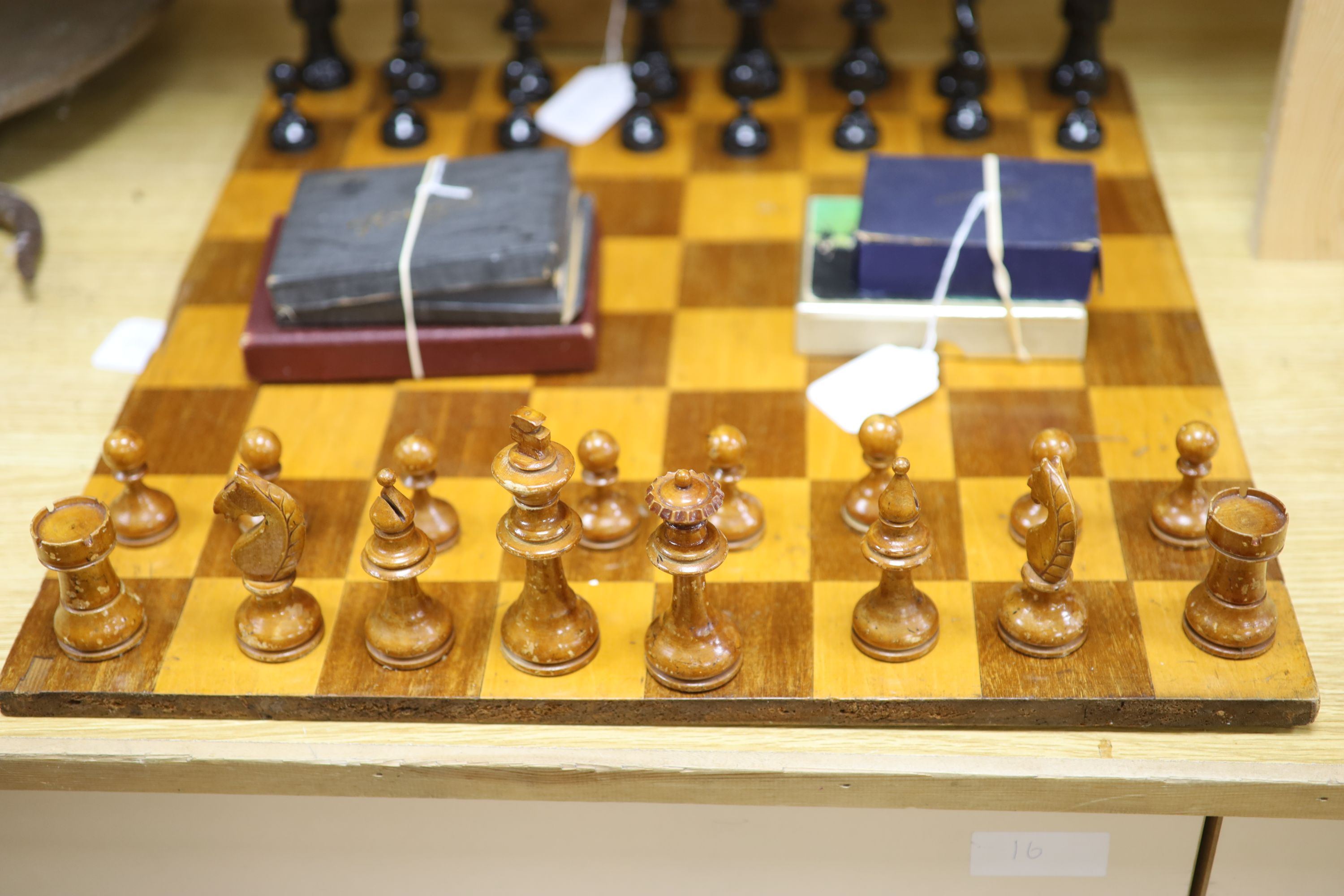 A Staunton style boxwood chess set, a chess board and miscellaneous card games